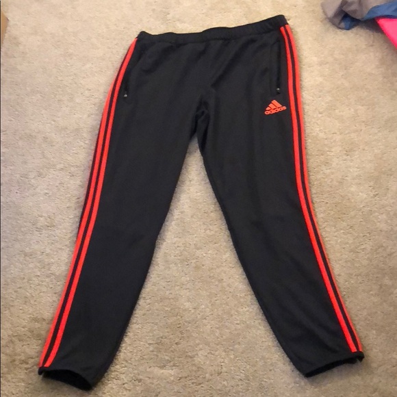 grey and orange adidas pants